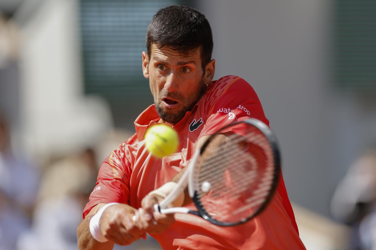 Novak Djokovic plays a shot during his first-round victory over Aleksandar Kovacevic at the French Open.