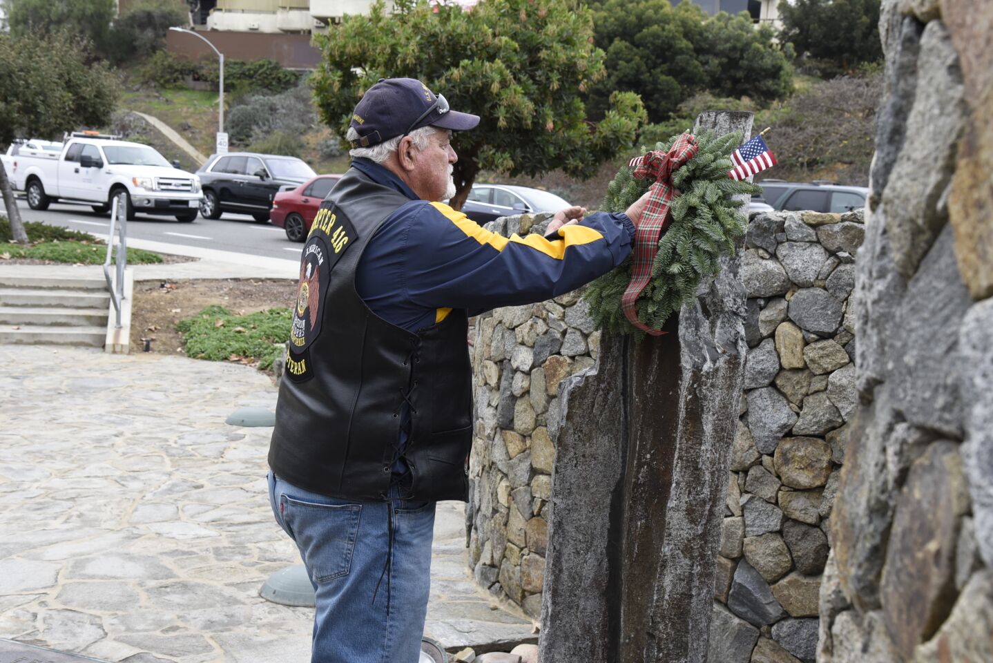 Lane Post lays the wreath honoring those lost at Pearl Harbor on Dec. 7, 1941