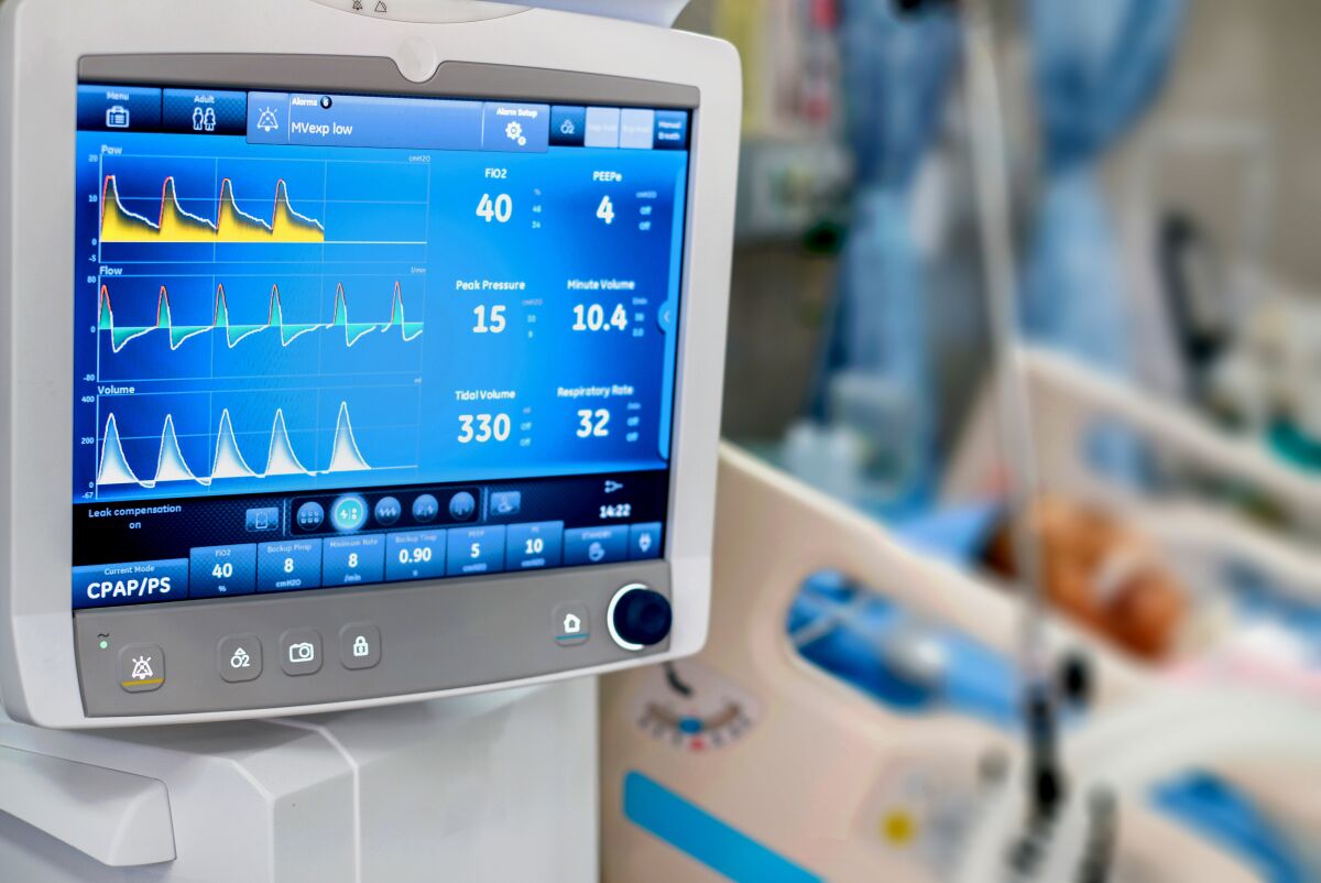 A patient is given oxygen by intubation in a hospital ICU.