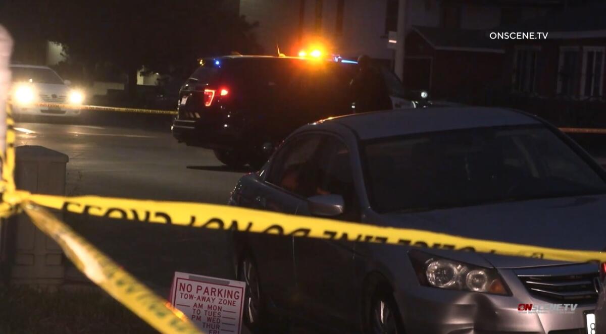 San Diego police officers investigate a fatal shooting May 16 in an alley off Orange Avenue in City Heights.