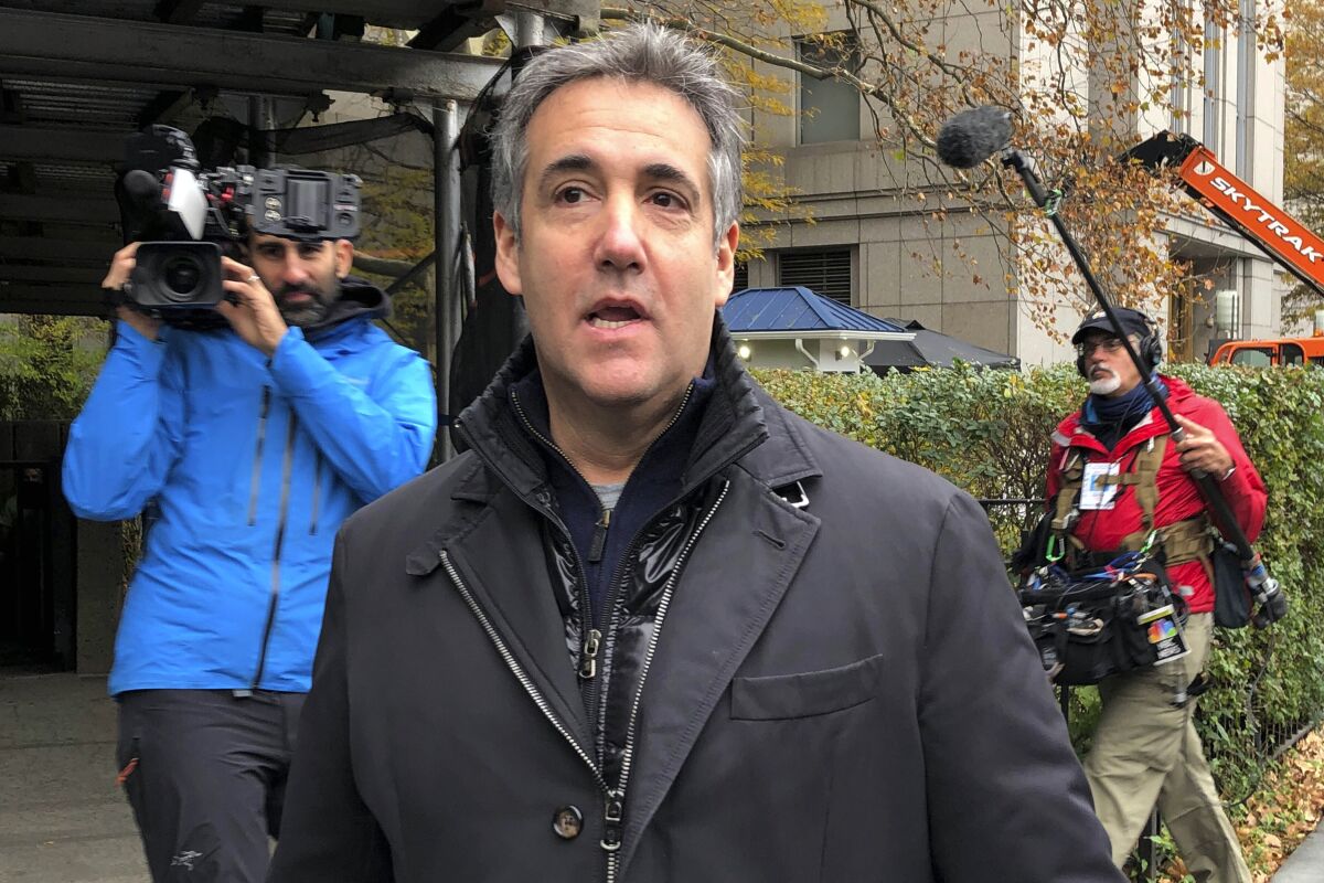 FILE - Michael Cohen, former President Donald Trump's longtime personal lawyer, arrives at Federal Court in New York, on Nov. 22, 2021, after completing his three-year prison sentence. Cohen claimed in a new lawsuit Thursday, Dec. 16, 2021, that Trump retaliated against him for writing a tell-all memoir, saying his abrupt return to federal prison last year endangered his life and amounted to punishment for criticizing the president. (AP Photo/Lawrence Neumeister, File)