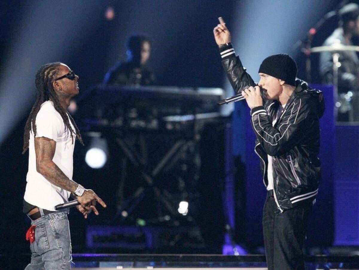 Eminem and Lil Wayne perform together during the Grammy show.