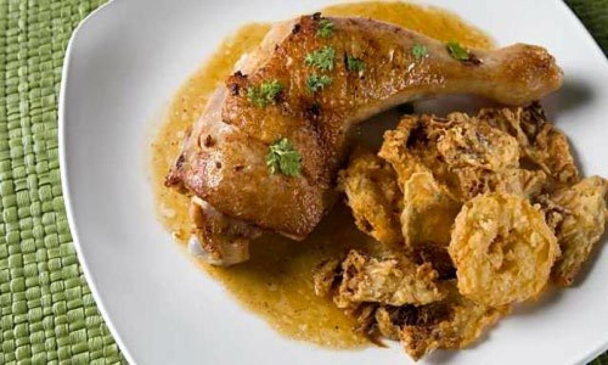FRAGRANT: Slices of fried artichokes and lemons accompany roasted chicken. Legs with the thighs attached not only make a fabulous display on the plate, theyre also moist and flavorful. Longer cooking times enhance this quality, and if you sear them before roasting, youll get extra-crisp golden-brown skin.