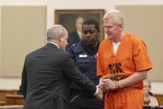 Alex Murdaugh shakes hands with his attorney Jim Griffin during his sentencing for stealing from 18 clients, Tuesday, Nov. 28, 2023, at the Beaufort County Courthouse in Beaufort, S.C. (Andrew J. Whitaker/The Post And Courier via AP, Pool)