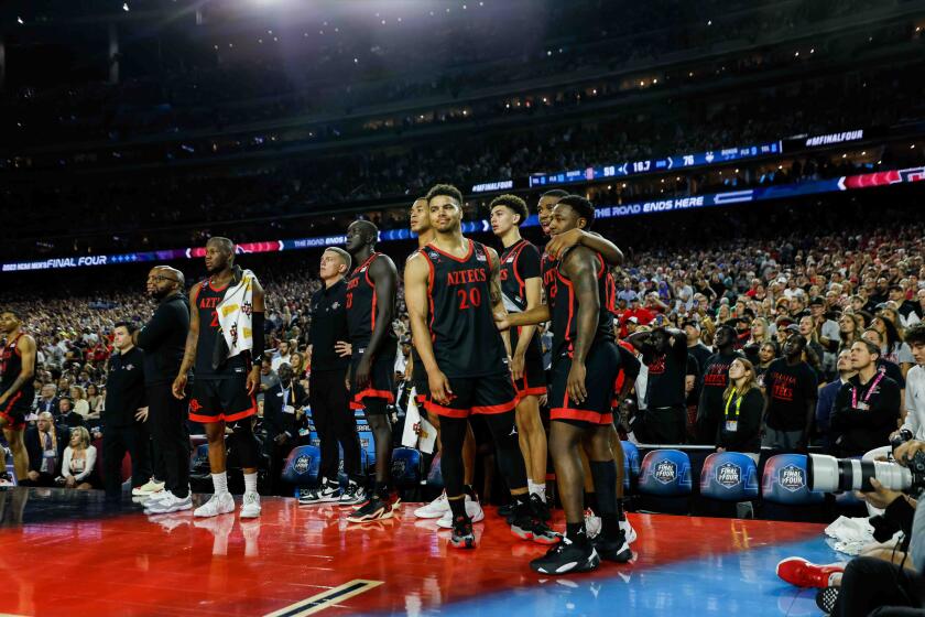Houston, TX - April 3: San Diego State players stand on the court after the national championship game of the 2023 NCAA MenOs Basketball Tournament played between the San Diego State Aztecs and the Connecticut Huskies at NRG Stadium on Monday, April 3, 2023 in Houston, TX. (K.C. Alfred / The San Diego Union-Tribune)