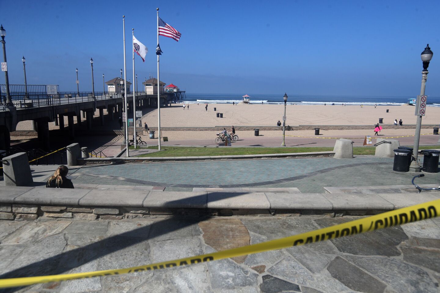 Few people were seen on the city beach in Huntington Beach on Saturday.