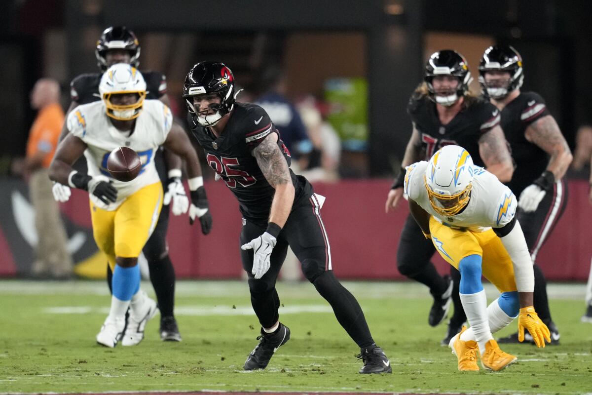 Arizona Cardinals tight end Trey McBride reaches for an incomplete pass in the first half against the Chargers on Monday.