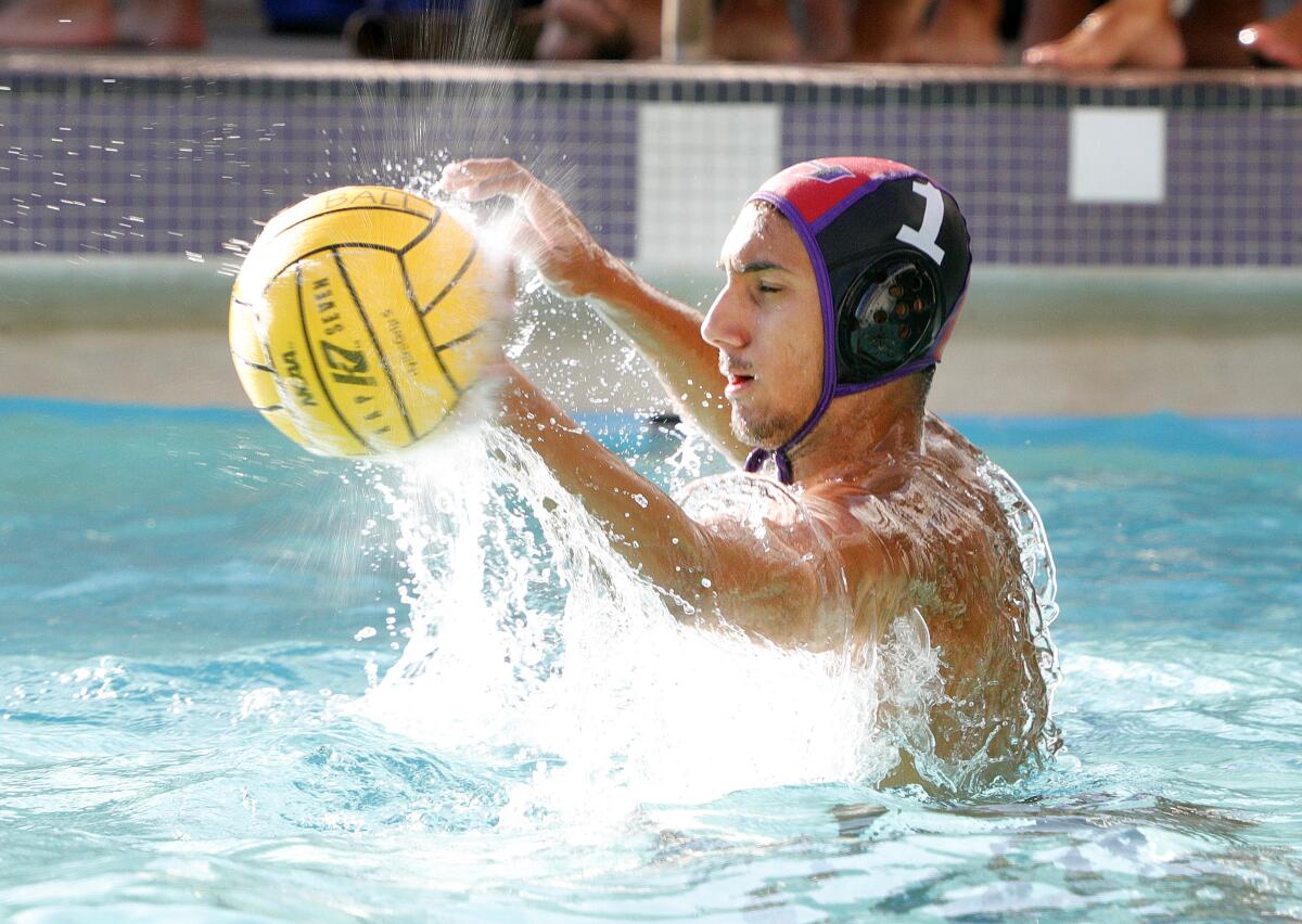 Hoover's goalie Oliver Baker makes a save on a Burbank shot in a Pacific League boys' water polo match at Hoover High School on Thursday, October 10, 2019. Hoover won the match.
