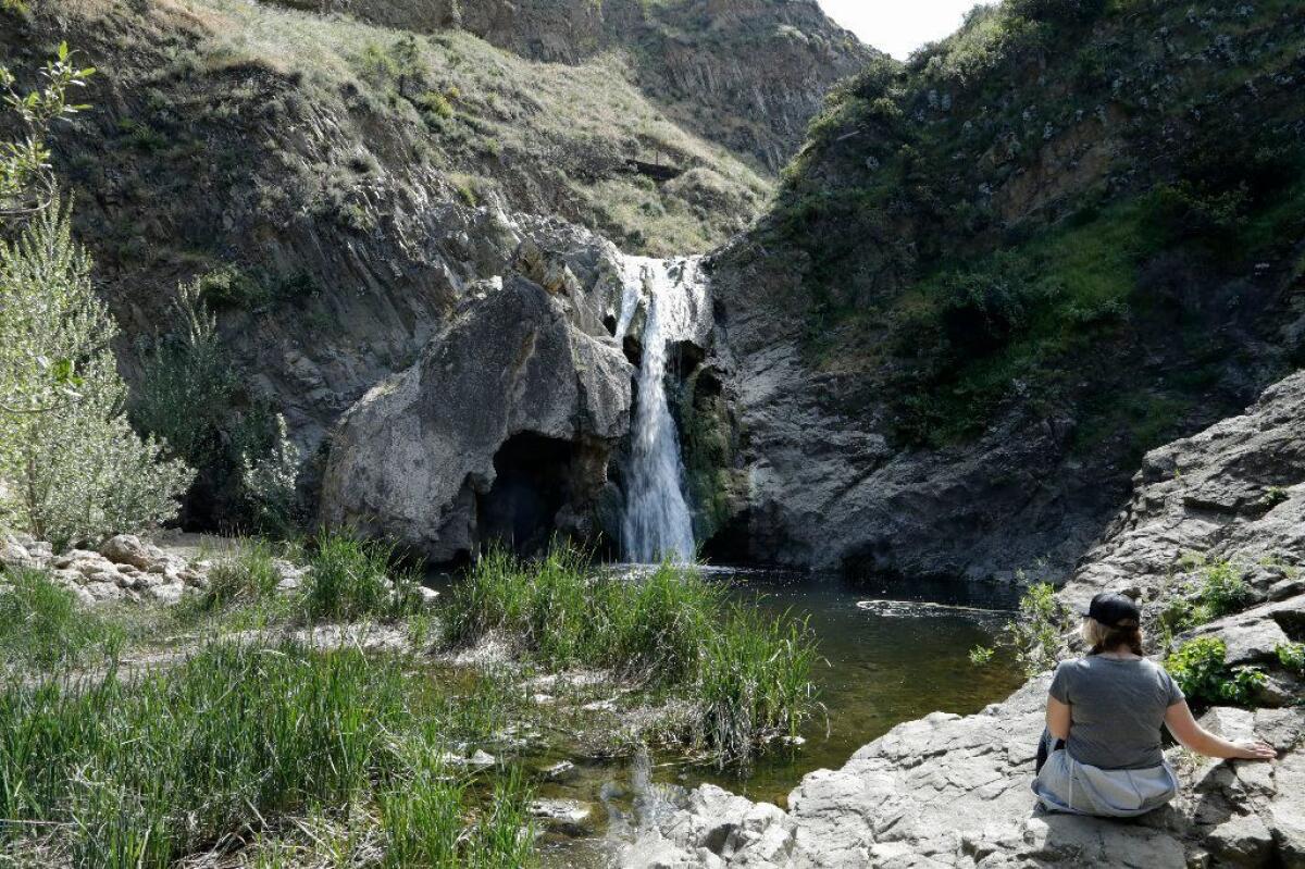 Kirstin Keagy of Ventura enjoys the view of Paradise Falls at Wildwood Regional Park in Thousand Oaks. 