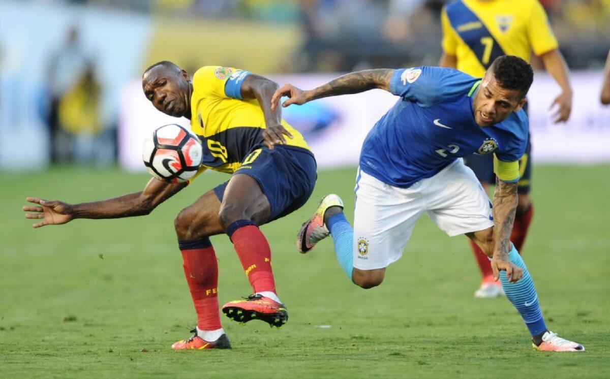 Ecuador's Walter Ayom battles Brazil's Dani Alves for the ball in the first half of a Copa America Centenario match at the Rose Bowl on June 4.