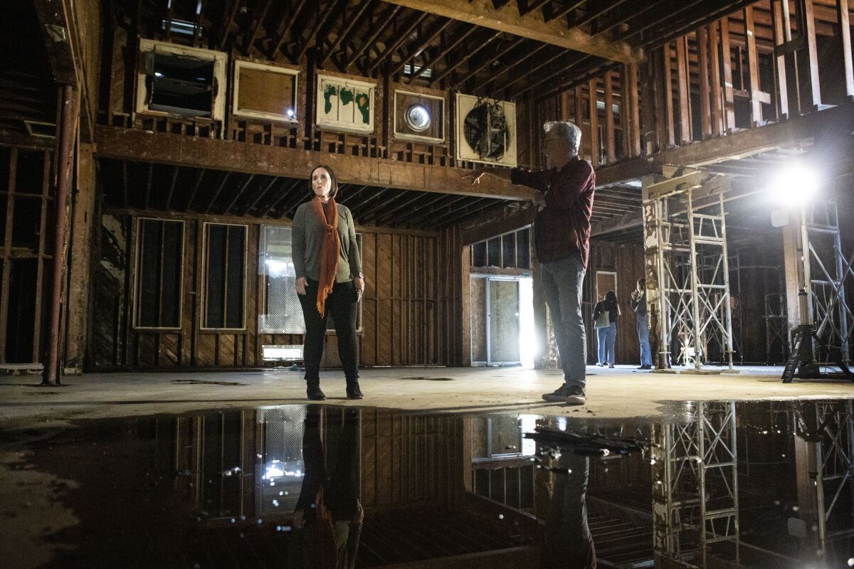 Lisa Johnson and Sean Murray tour the space that will become the Joan and Irwin Jacobs Performing Arts Center.