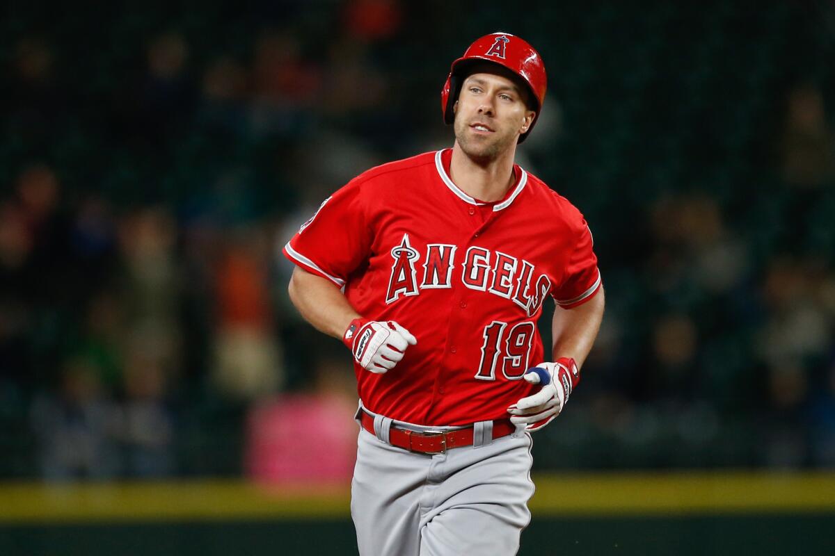 David Murphy rounds the bases after hitting a three-run home run against Seattle in the third inning of the Angels' 4-3 win Tuesday over the Mariners.