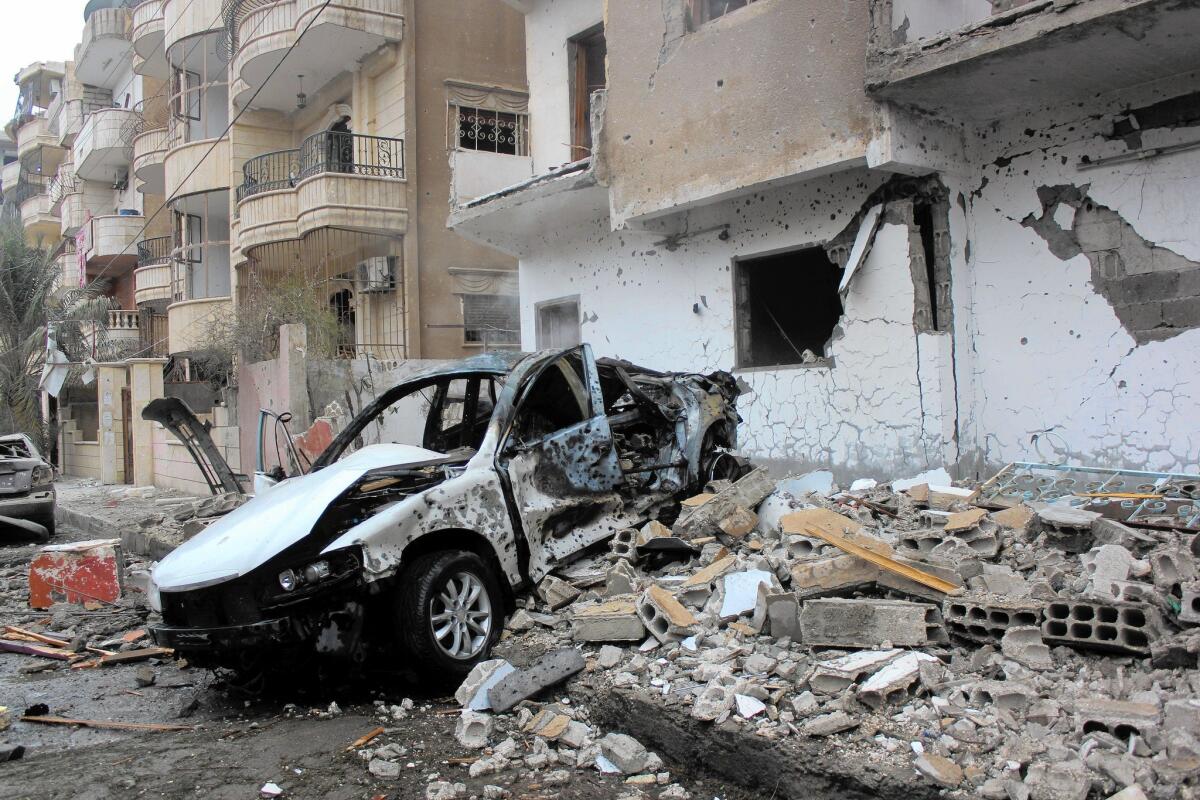 Debris covers a street in Raqqah after a December airstrike believed to be by Syrian government forces. The U.S. is investigating whether its own strikes against Islamic State in Syria and Iraq have killed civilians.