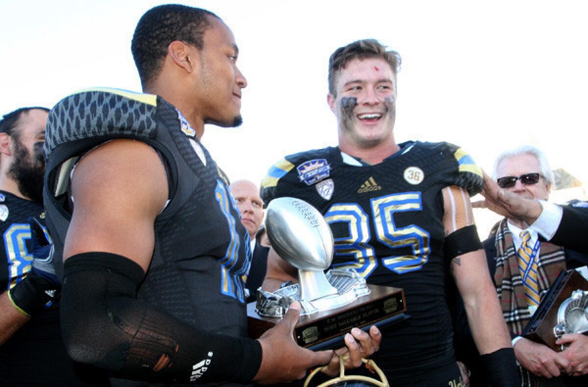 UCLA quarterback Brett Hundley, left, and linebacker Jordan Zumwalt were chosen co-Most Valuable Players at the Sun Bowl.