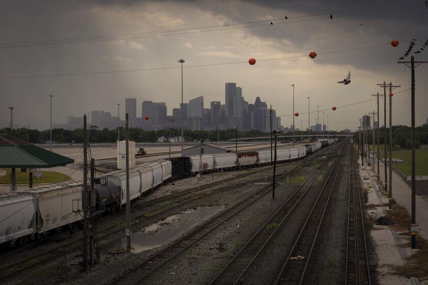 FILE - Union Pacific's Englewood rail yard is seen, Aug. 12, 2022, in Houston. On Wednesday, Sept. 27, 2023, Houston officials approved $5 million for a fund to help relocate residents from neighborhoods located near the rail yard polluted by a cancer-linked wood preservative that has been blamed for an increase in cancer cases. Creosote, which has been associated with an increased risk of contracting cancer, was used for more than 80 years at the site until the 1980s. City officials say the contamination has reached the groundwater in the neighborhoods. (Jon Shapley/Houston Chronicle via AP, File)