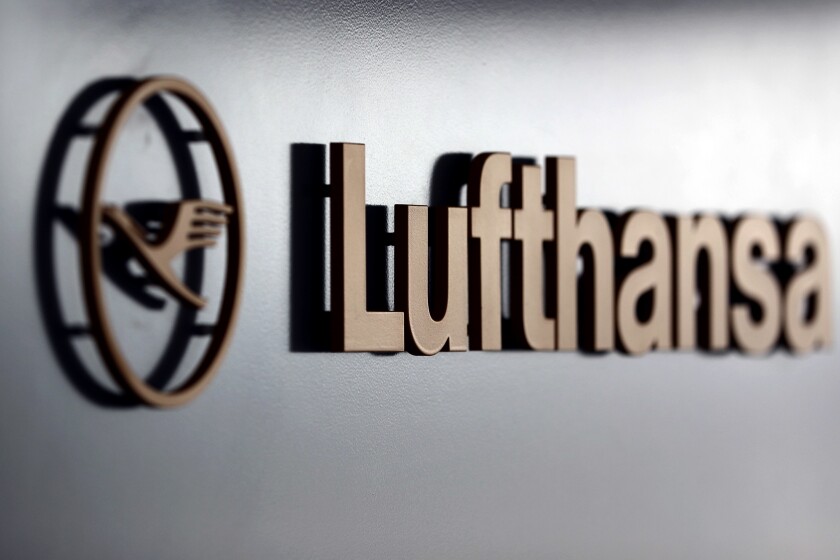 FILE - In this Thursday, March 16, 2017 file photo, the logo of German Lufthansa airline is attached at a gate during the company's annual press conference in Munich, Germany. German officials say Germany has denied Russian airlines permission to use its airspace after Moscow failed to approve a Lufthansa flight to Russia. In a statement, Germany’s Transport Ministry said the decision was based on the practice of reciprocal approval of flights, and affected connections operated by Aeroflot and budget carrier S7. The tit-for-tat decision on Wednesday, June 2, 2021 comes amid mounting tension between Russia and the European Union over Moscow’s support for Belarus. (AP Photo/Matthias Schrader, file)