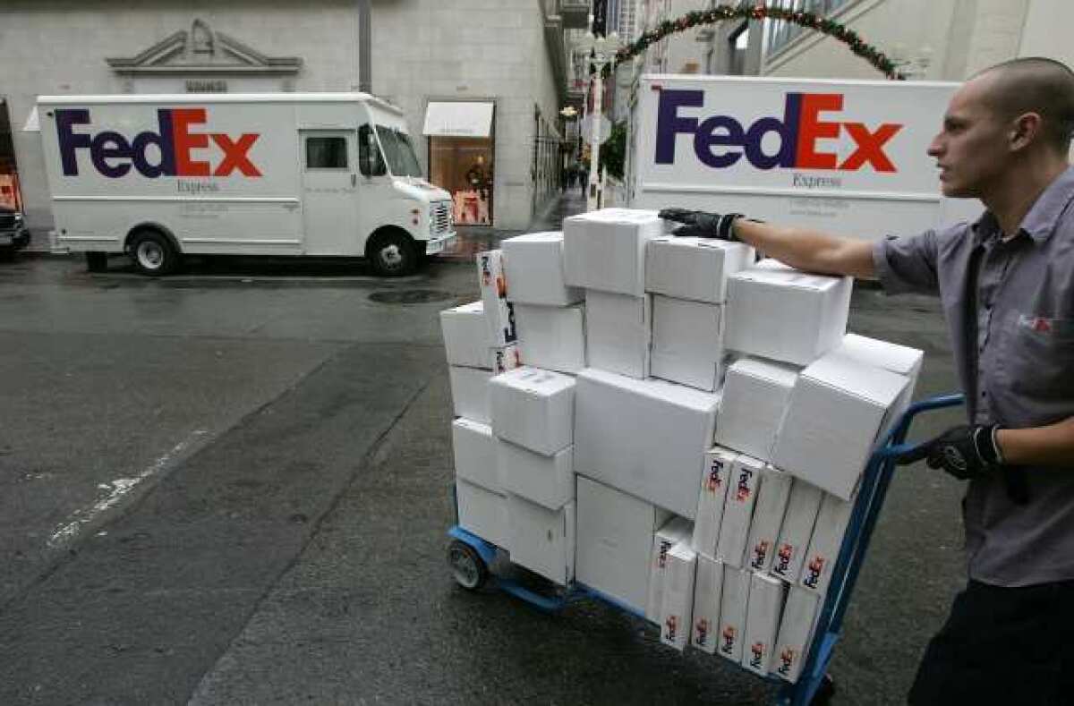 FedEx more than doubled its profit in its third quarter but warned of rough economic times ahead.