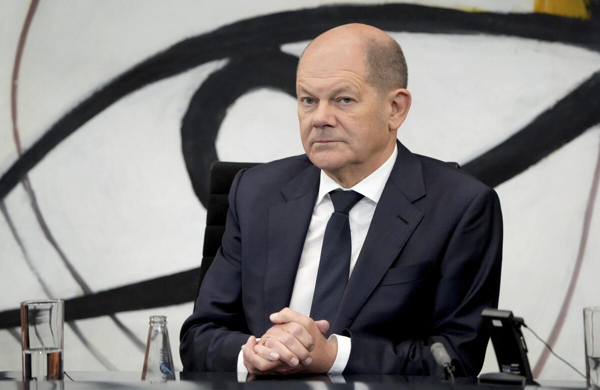 German Chancellor Olaf Scholz, attends a press conference after a meeting of the representatives of international finance- and economy organizations at the chancellery in Berlin, Germany, Tuesday, Nov. 29, 2022. (AP Photo/Michael Sohn)