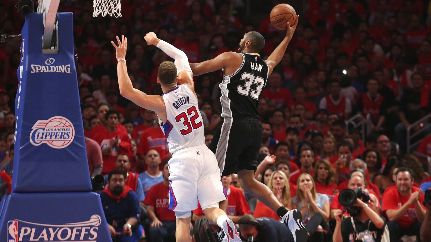 San Antonio Spurs forward Boris Diaw, right, shoots over Clippers forward Blake Griffin during the first half of Game 7 of the Western Conference quarterfinals at Staples Center on May 2, 2015.