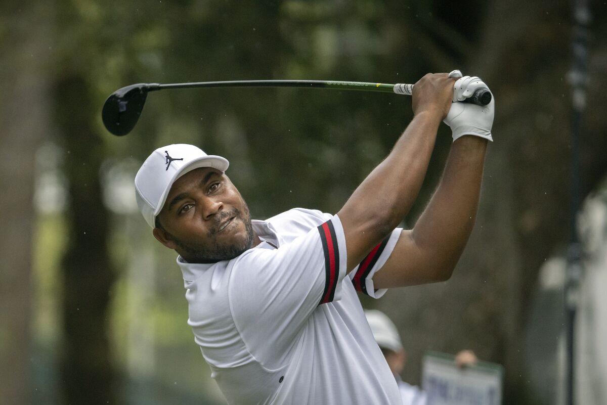 Harold Varner III watches his drive down the 16th fairway during the third round of the RBC Heritage golf tournament, Saturday, April 16, 2022, in Hilton Head Island, S.C. (AP Photo/Stephen B. Morton)