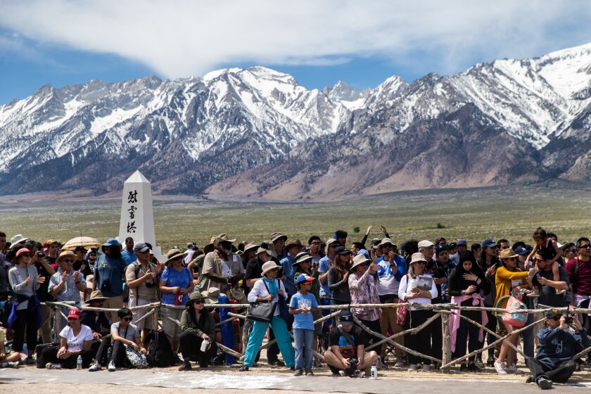 INDEPENDENCE, CALIF. - APRIL 27: People crowd the cemetery area during the annual Manzanar Pilgrimage at the Manzanar War Relocation Camp on Saturday, April 27, 2019 in Independence, Calif. (Kent Nishimura / Los Angeles Times)