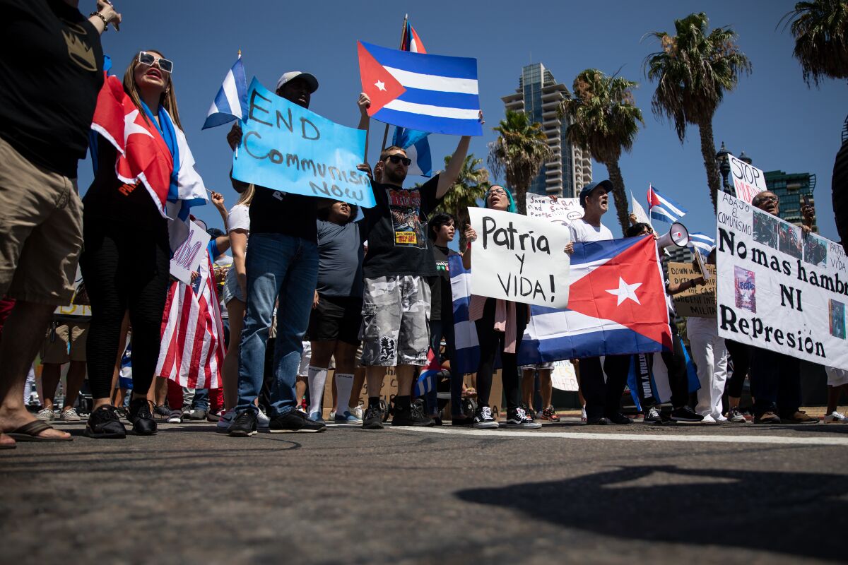 Protesters march through Downtown San Diego on Sunday to show support for Cubans unhappy with their government. 