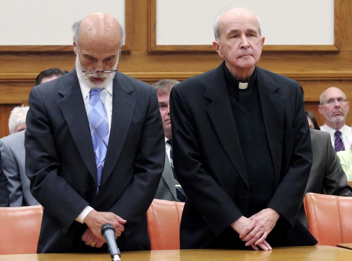 The Rev. Gerald Robinson with attorney Alan Konop in a Toledo, Ohio, courtroom on May 11, 2006, as the verdict is read finding Robinson guilty of murder in the stabbing death of a nun in 1980.