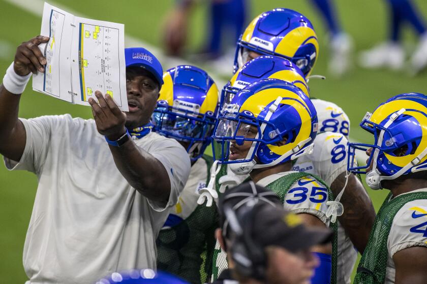 INGLEWOOD, CA - AUGUST 22: Rams assistant special teams coach Tory Woodbury, left, with players before scrimmage at SoFi Stadium Saturday, Aug. 22, 2020 in Inglewood, CA. Brian van der Brug / Los Angeles Times)