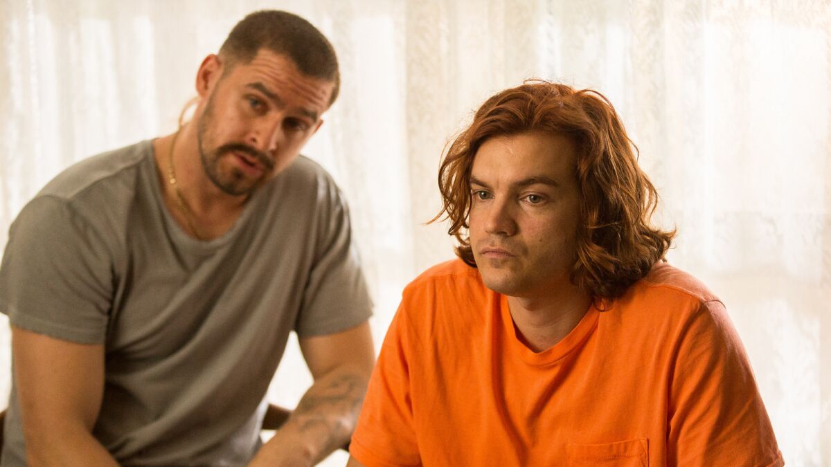 Jack Kesy, left, and Emile Hirsch in the movie "Peel."