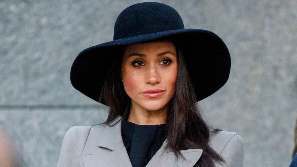 Meghan Markle, the American fiancee of Britain's Prince Harry, attends an Anzac Day dawn service at Hyde Park Corner in London on April 25.