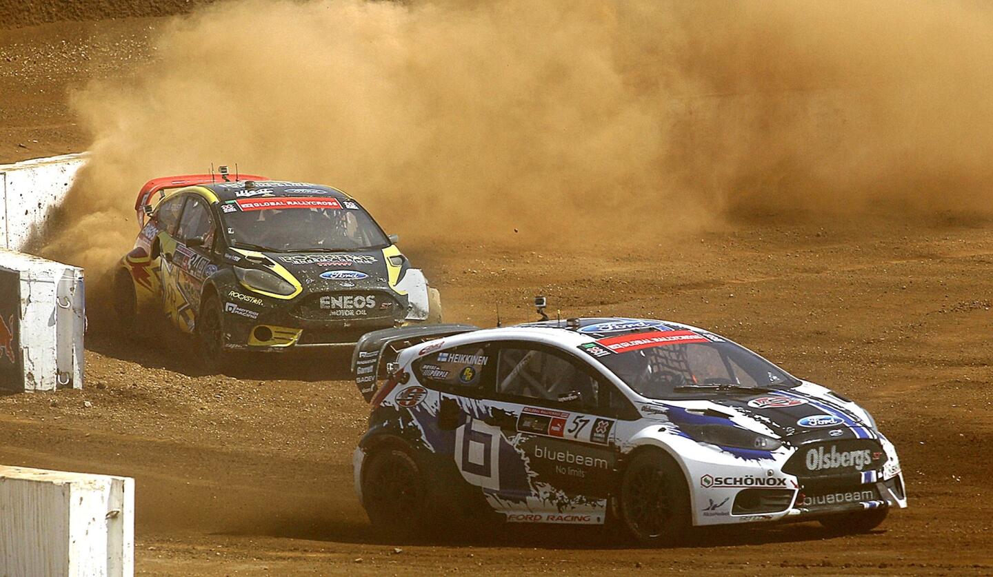 Drivers Toomas Heikkinen, right, and Tanner Foust compete in the X Games RallyCross SuperCar Final at Irwindale Event Center on Sunday.