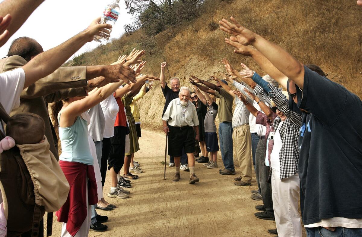 In August 2008, Sol Shankman, then 93, is greeted by friends and family as he arrives for a ceremony at Griffith Park to dedicate a bench on his behalf. Behind Shankman is L.A. City Councilman Tom LaBonge, who sponsored the dedication.