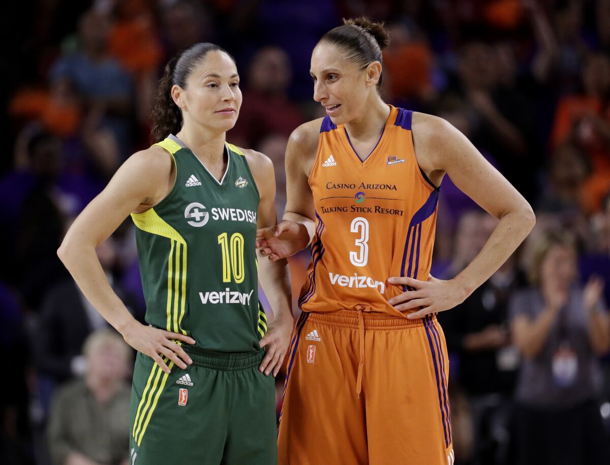 FILE - Phoenix Mercury guard Diana Taurasi (3) talks with Seattle Storm guard Sue Bird (10) during the second half of a single-game WNBA basketball playoff matchup, Wednesday, Sept. 6, 2017, in Tempe, Ariz. Seattle's Sue Bird and Mercury star Diana Taurasi share the court perhaps for the last time in a WNBA clash in Phoenix, Friday, July 22, 2022. (AP Photo/Matt York)