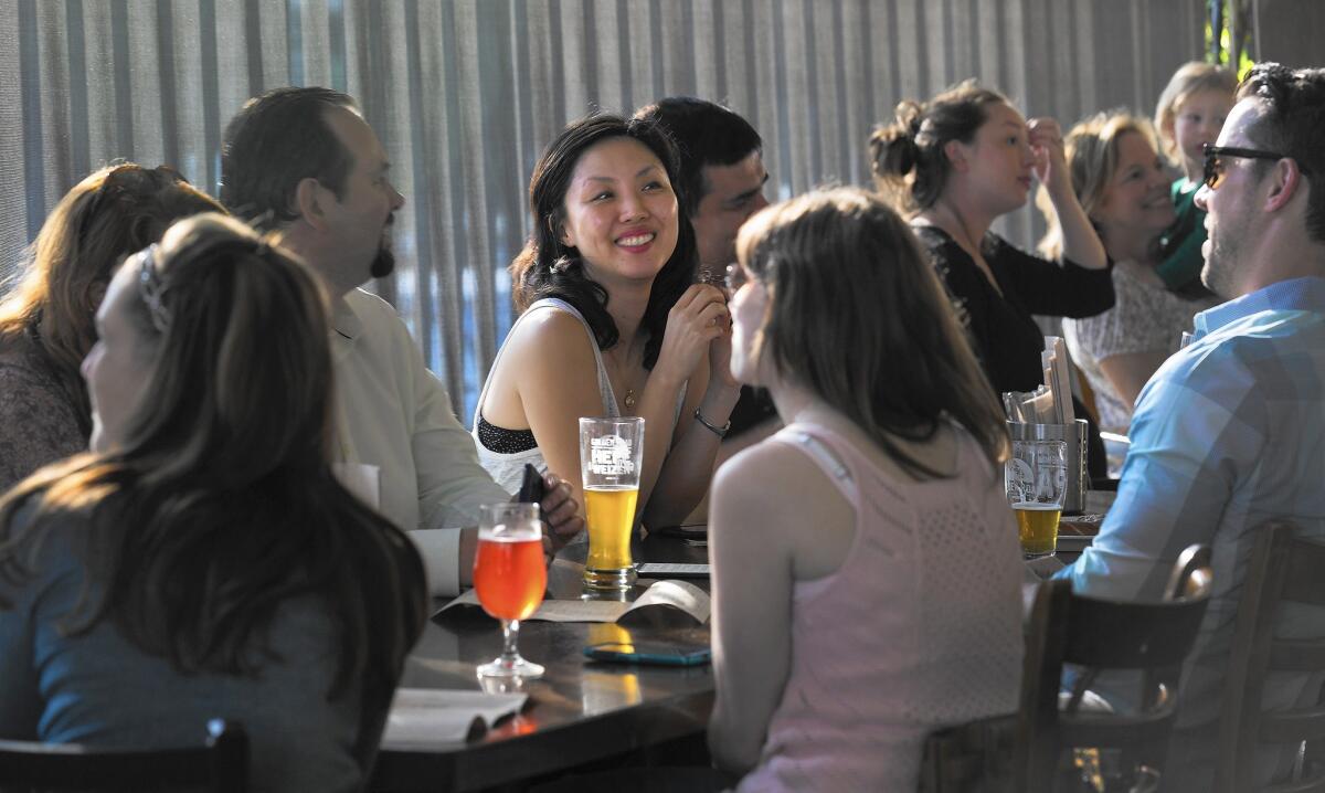 Patrons at Golden Road Brewing enjoy beer and food in Los Angeles on June 12.