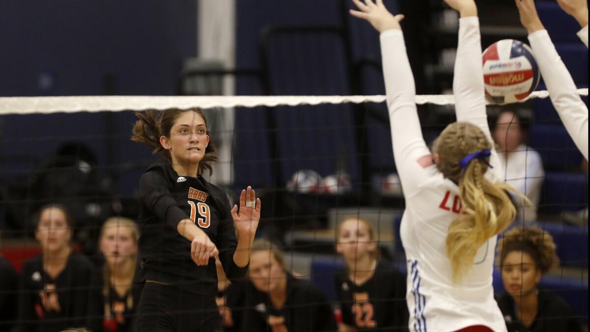 Huntington Beach High's Sabrina Phinizy (19), shown scoring against Los Alamitos on Sept. 19, led the Oilers to four-set win at Esperanza in the first round of the CIF Southern Section Division 2 playoffs on Thursday.