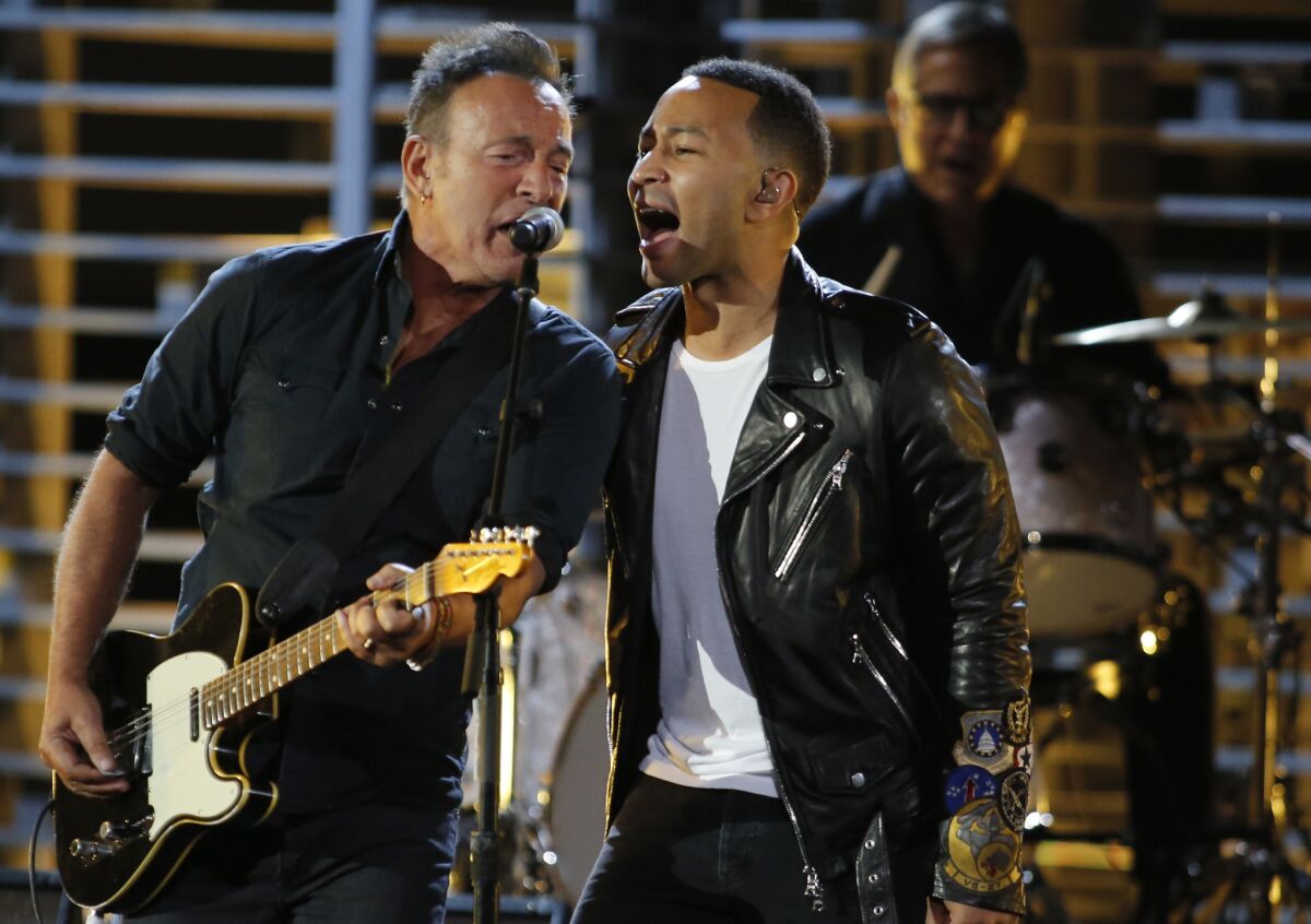 Bruce Springsteen and John Legend perform "American Skin (41 Shots)" at the Shrine Auditorium for the A&E special "Shining a Light: A Concert for Progress on Race in America."