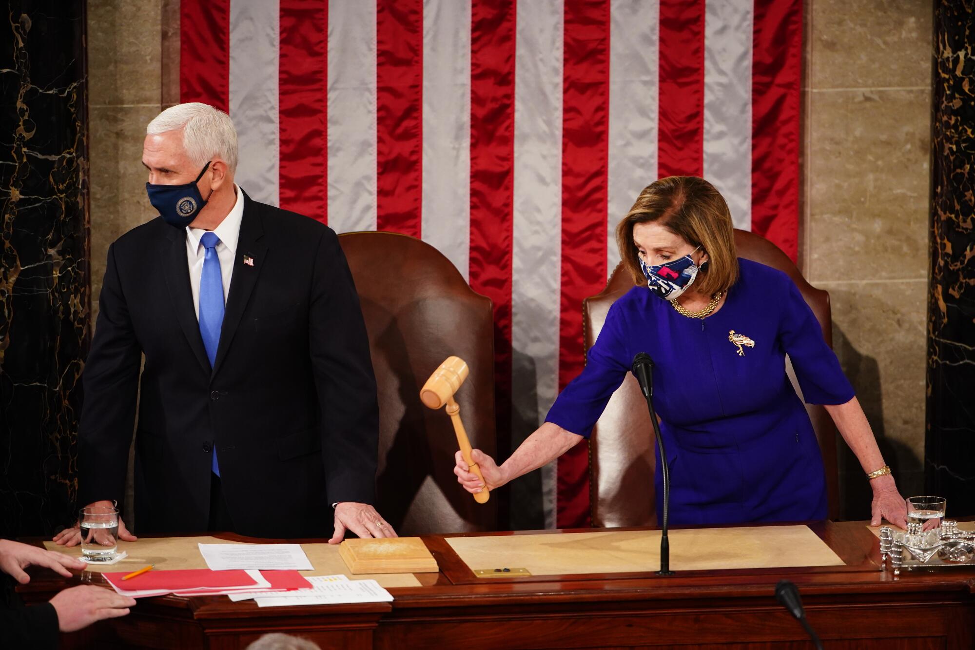 Mike Pence stand next to Nancy Pelosi, who holds the gavel