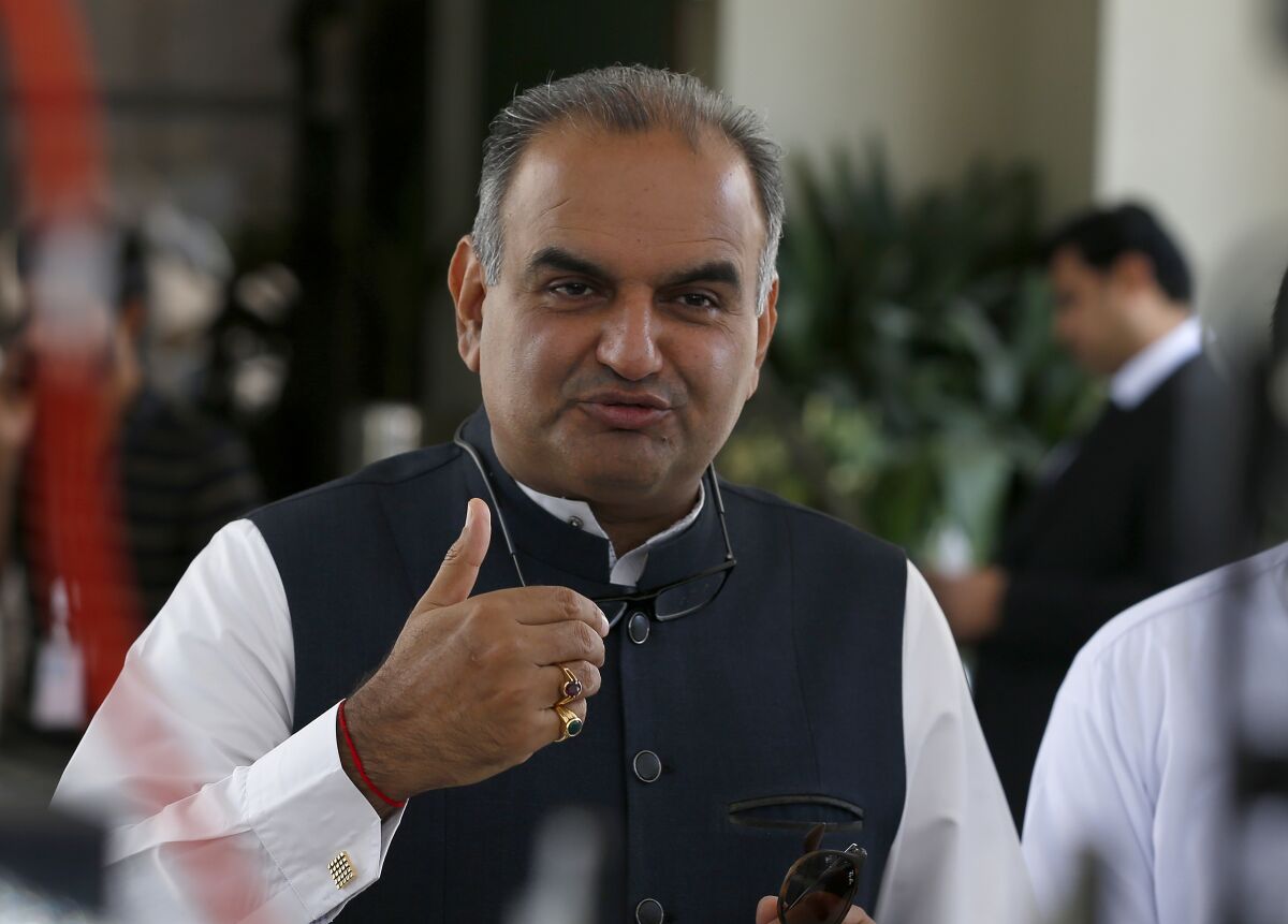Ramesh Kumar, a Pakistani lawmaker and leader of Hindu community, talks to media after the hearing of the Hindu temple attack case in Islamabad, Pakistan, Friday, Aug. 6, 2021. A Muslim mob stormed a Hindu temple in a remote town in Pakistan's eastern Punjab province on Wednesday, damaging statues and burning down the temple's main door. The attack followed an alleged desecration of a madrassa, or religious school, by a Hindu boy earlier this week, police said. (AP Photo/Anjum Naveed)