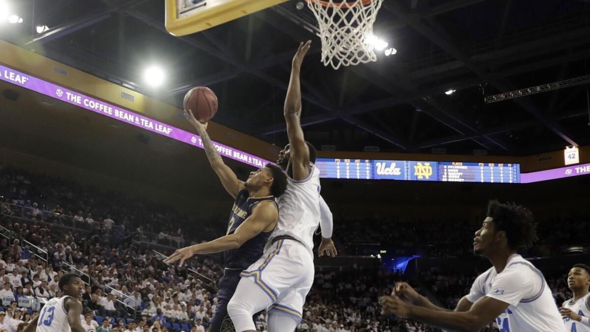 UCLA forward Cody Riley prepares to block a shot by Notre Dame guard Prentiss Hubb in the final minute of their game Dec. 8.