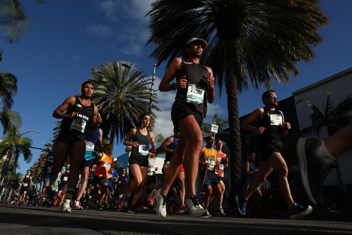 People running on a street during the L.A. Marathon