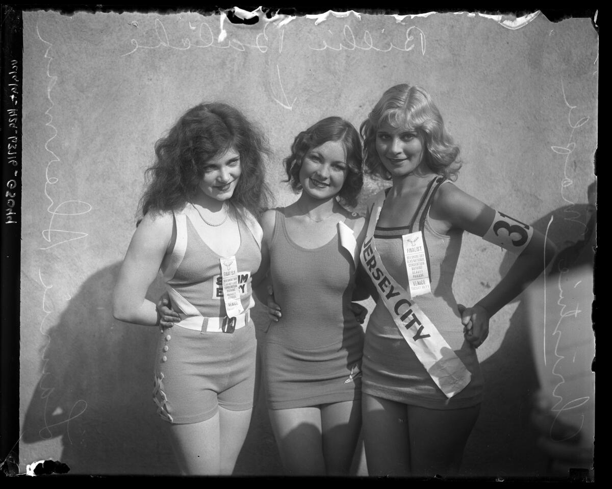 Three women in swimsuits at a beauty contest in 1935.