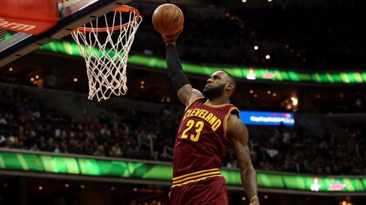 Cleveland forward LeBron James dunks the ball during the first half of a game against the Wizards on Nov. 11.