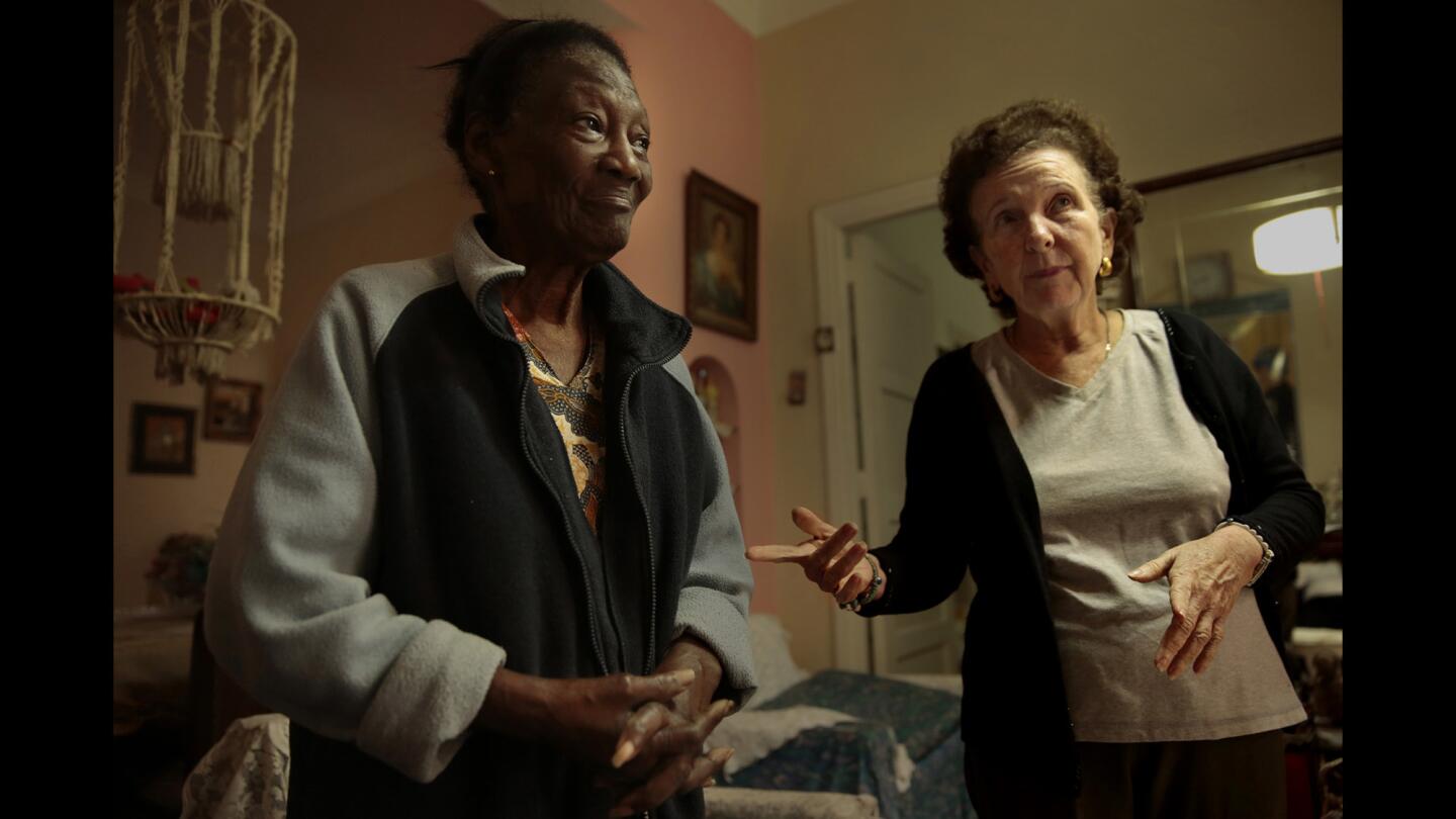 Frida Zaitman, 61, and Magda Danger, 88, at their home in Havana. The neat but cramped two-bedroom apartment tells of a generation of lives intertwined.