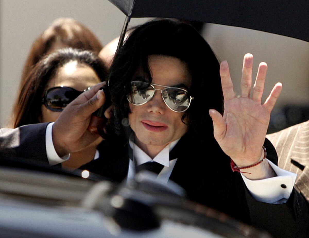 Michael Jackson walks out of the Santa Maria Courthouse after being acquitted in a molestation case in 2005.