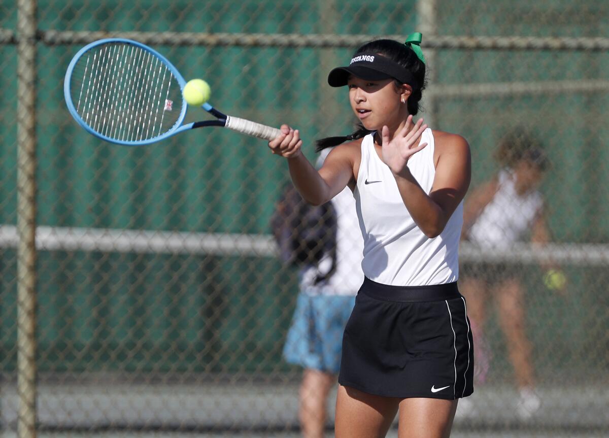 Costa Mesa's Hallie Tran hits against Calvary Chapel in a singles set of an Orange Coast League match on Thursday.