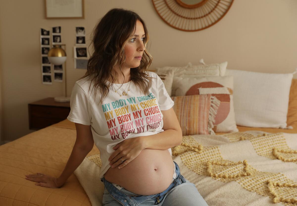 Chelsea Maras, 22 weeks pregnant, is photographed at home in Huntington Beach