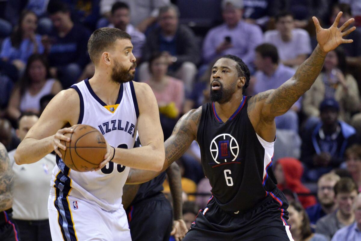 Grizzlies center Marc Gasol, left, looks to pass as he's guarded by Clippers center DeAndre Jordan during the first half. The Clippers prevailed, 114-98, at Memphis.
