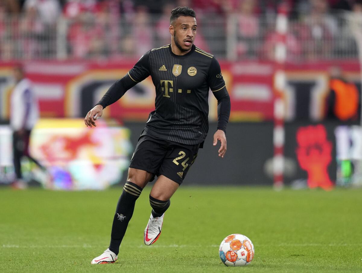 FILE - Bayern's Corentin Tolisso plays the ball during the German Bundesliga soccer match between 1. FC Union Berlin and FC Bayern Munich in Berlin, Germany, Saturday, Oct. 30, 2021. Lyon brought France midfielder Tolisso back to the club on a five-year contract Friday, July 1, 2022. (AP Photo/Michael Sohn, File)