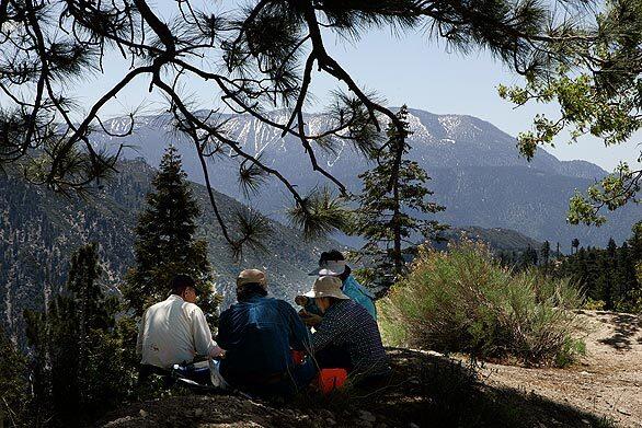 Tourists visiting Big Bear Lake stop for a picnic lunch along Highway 18. The areas shady woods and rocky shores provided the backdrop for such classic movies as Old Yeller, Gunsmoke, and Gone With the Wind.