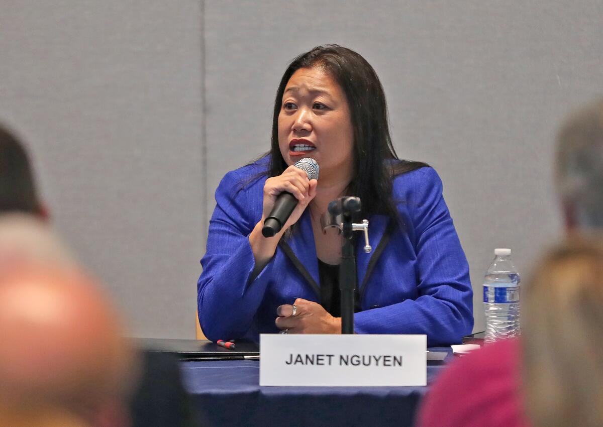 State assembly candidate Janet Nguyen answers a question to the audience.